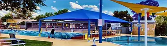 Outdoor pool with shade sails
